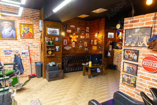 London, UK - October 28, 2022: Barbershop working place interior. Stylish hairdressing salon interior