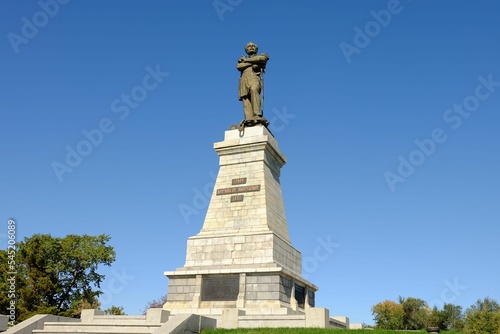 Low angle shot of the Monument to Nikolay Muravyov-Amursky statue in Russia under blue sky photo