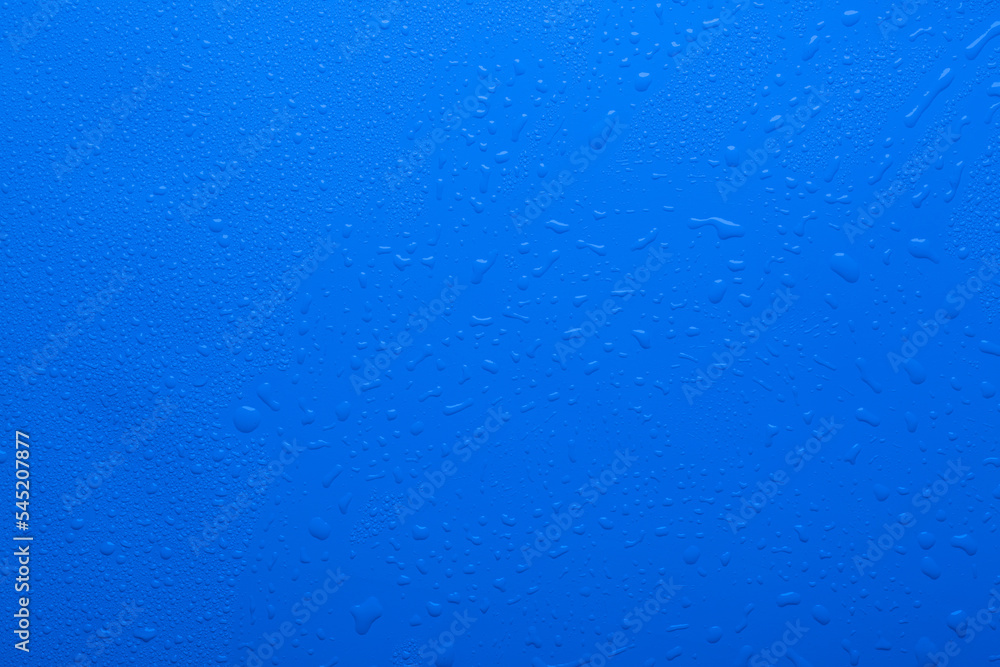Water drops on blue color surface raindrops Water drops on blue color surface raindrops