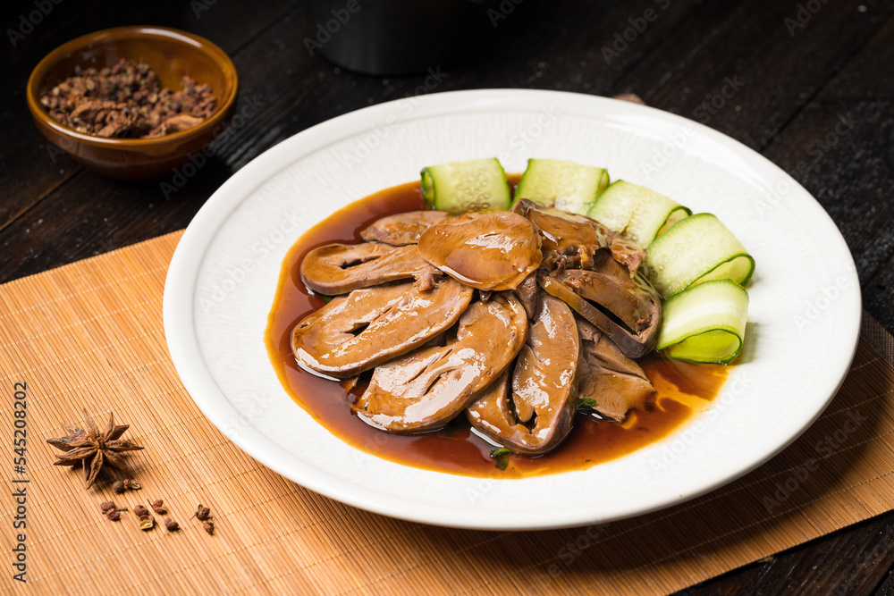Special Chinese food braised pork heart on retro background Special Chinese food braised pork heart on retro background