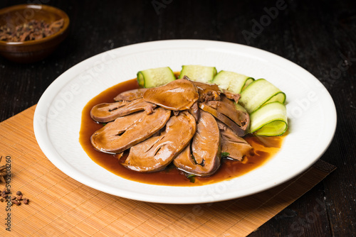 Special Chinese food braised pork heart on retro background