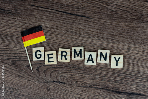 German - wooden word with germany flag (wooden letters, wooden sign)
