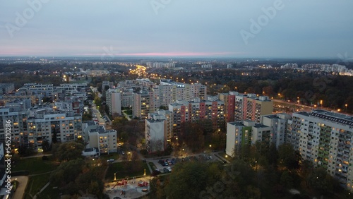 Aerial view of a city panorama of Wroclaw, Poland, during the sunset, with street lights turned on