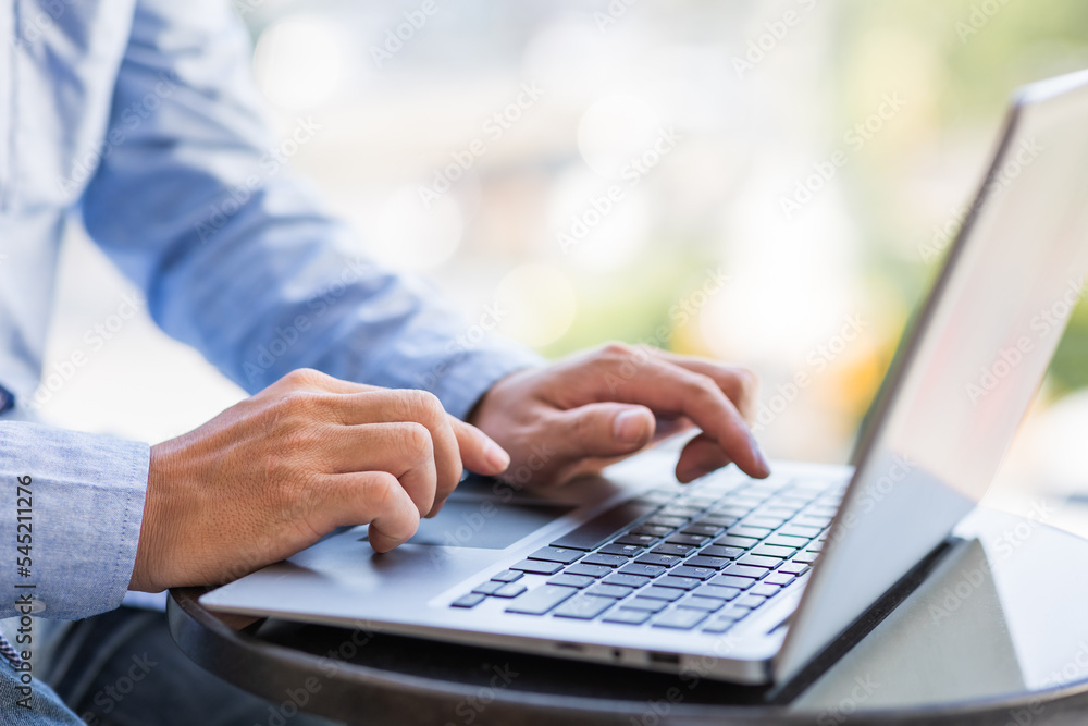 Image of male hands typing on keyboard, selective focus. Image of male hands typing on keyboard, selective focus.