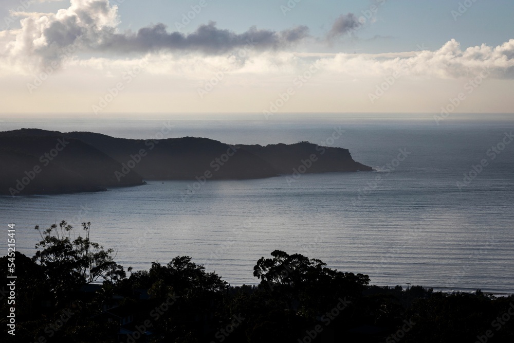 Fototapeta premium And misty outlook over Umina Beach and Ettalong and Woy Woy on NSW Central Coast in Australia