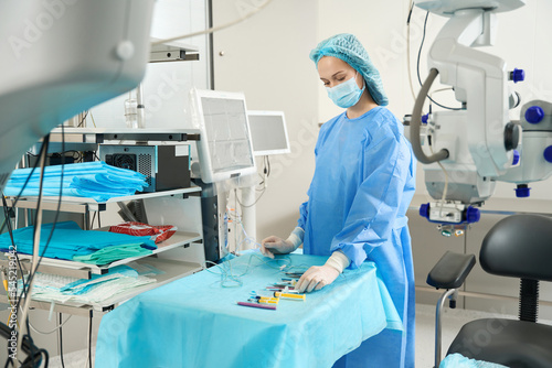 Nurse preparing equipment for surgery in hospital