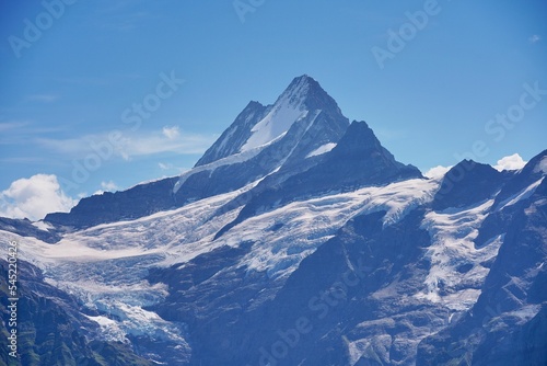 Beautiful Schreckhorn mountain in the Bernese Alps covered in snow against a blue sky © Fidel Fernando/Wirestock Creators