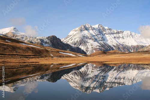 Amazing reflections in lake Plan du Lac Bellecombe looking towards La Grande Casse in the French alps
