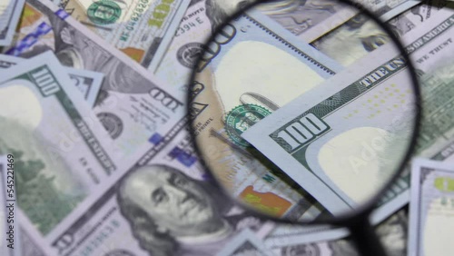 Wallpaper Mural One hundred dollar banknote under magnifying glass. USA national currency. Banking and financial concept Torontodigital.ca