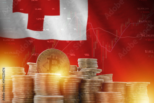 Tonga flag and big amount of golden bitcoin coins and trading platform chart. Crypto currency photo