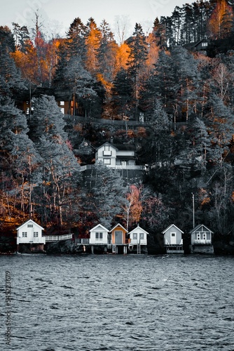 Photography Small fish boat houses on the water in Oslo, Norway.