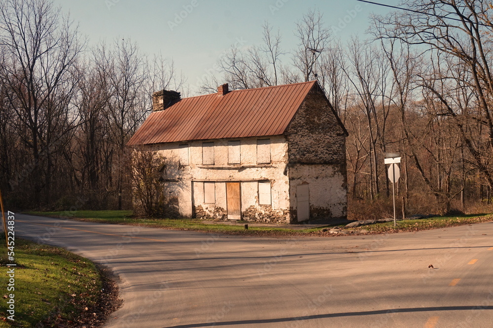 Old Abandoned Peeling White Home in Rural Fall Setting Old Abandoned Peeling White Home in Rural Fall Setting