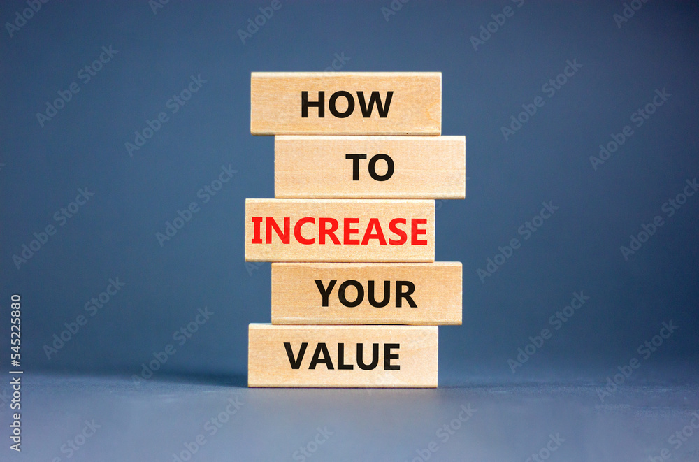 Increase your value symbol. Concept words How to increase your value on wooden blocks. Beautiful grey table grey background. Business how to increase your value concept. Copy space.