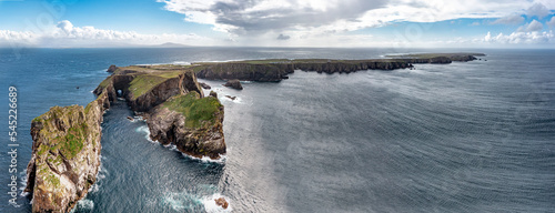 The cliffs and sea stacks An Tor Mor and the Wishing Stone at Port Challa on Tory Island, County Donegal, Ireland