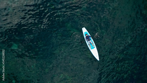 Aerial view of a person in a kayak floating on the water in Bali, Indonesia © Ocduo/Wirestock Creators