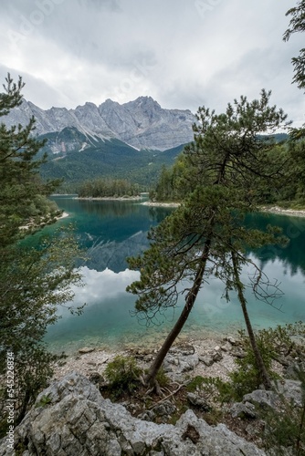 Vertical shot of a lake with the mountains in the background