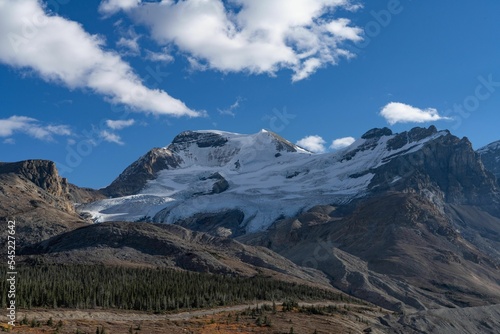Beautiful shot of rough mountains covered in snow in the daytime © Patricia Zhao/Wirestock Creators