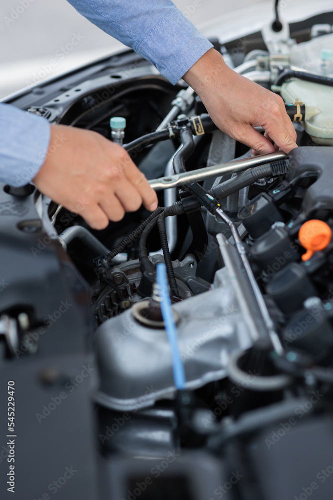 Man with checking car engine. Man with checking car engine.
