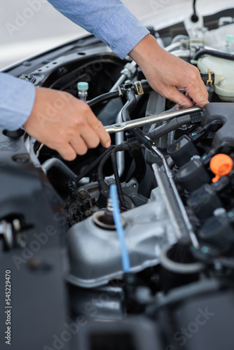 Man with checking car engine. © Witoon
