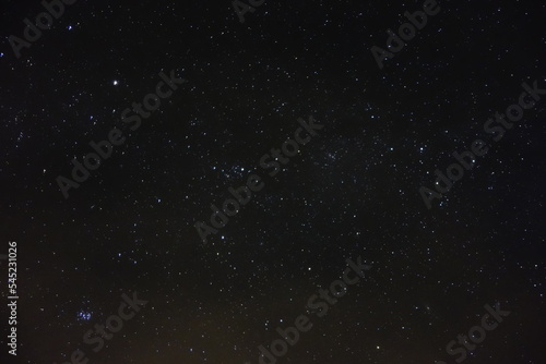 Stars in the sky at night in October Northern Hemisphere with possible man-made artifacts 