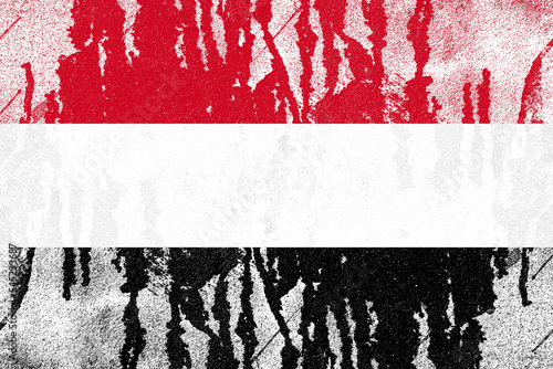 Yemen flag painted on old distressed concrete wall background