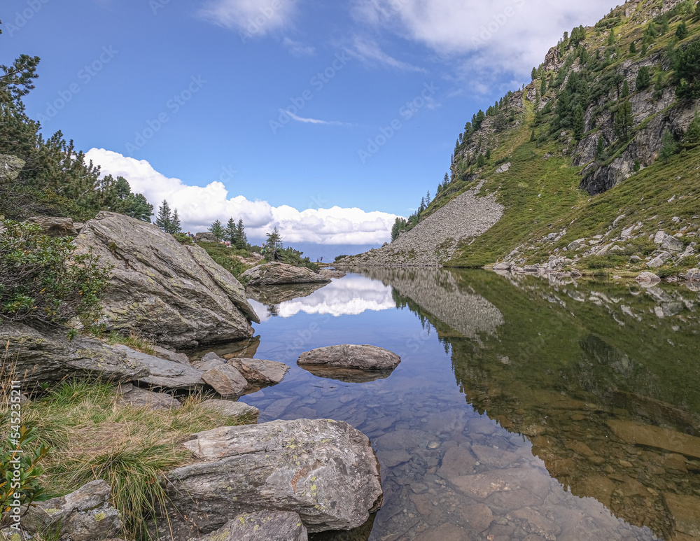 Fototapeta premium View of Spiegelsee [Mirror lake] as seen on the trial from Rippetegg summit back to Rieteralm, Schladming, Styria, Austria