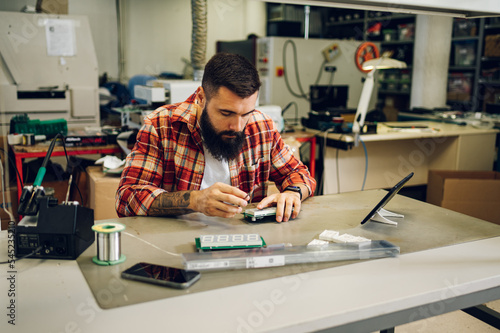 Electronics engineer working in a professional workshop