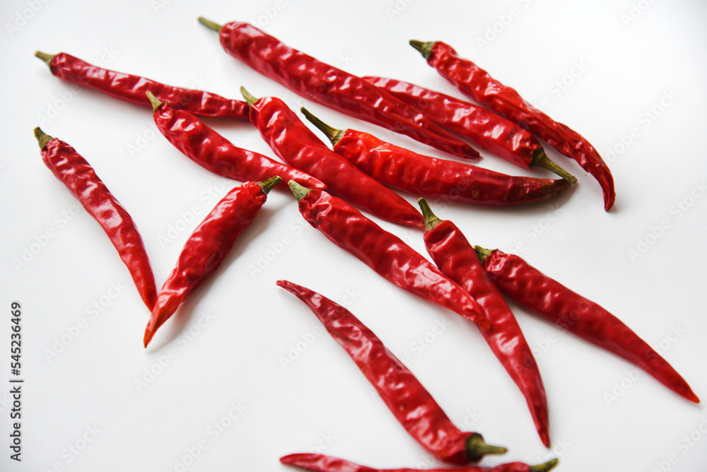 Red hot capsicum on a white background. Red pepper close-up. Red hot capsicum on a white background. Red pepper close-up.