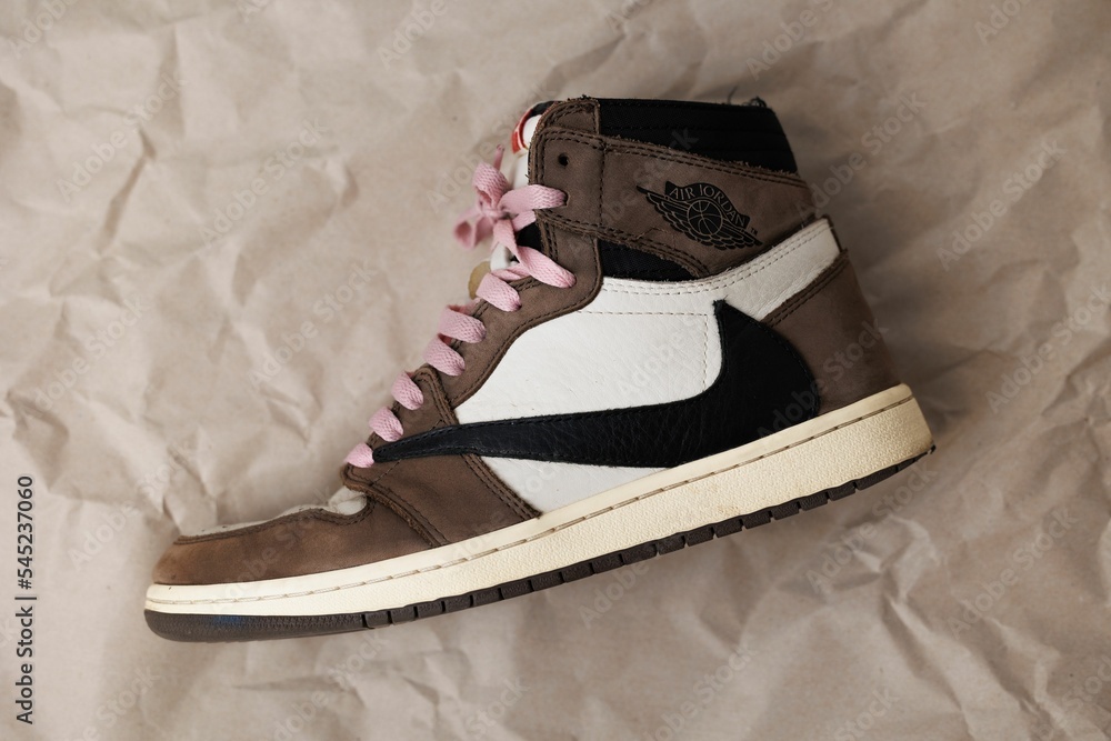 Closeup of Nike Air Jordan 1 High 'Travis Scott' with pink shoe laces.  Stock Photo | Adobe Stock
