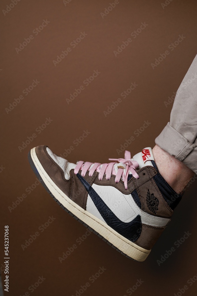 Vertical closeup of Nike Air Jordan 1 High 'Travis Scott' with pink shoe  laces. Stock Photo | Adobe Stock