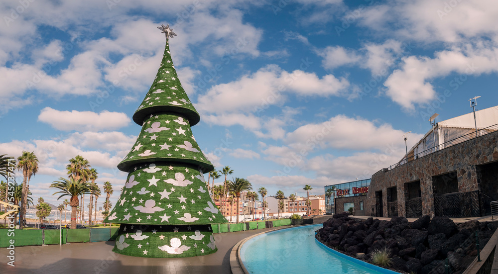 Christmas tree decorations and market outdoors, on the beach in Las Palmas de Gran Canaria, in winter holiday, Spain