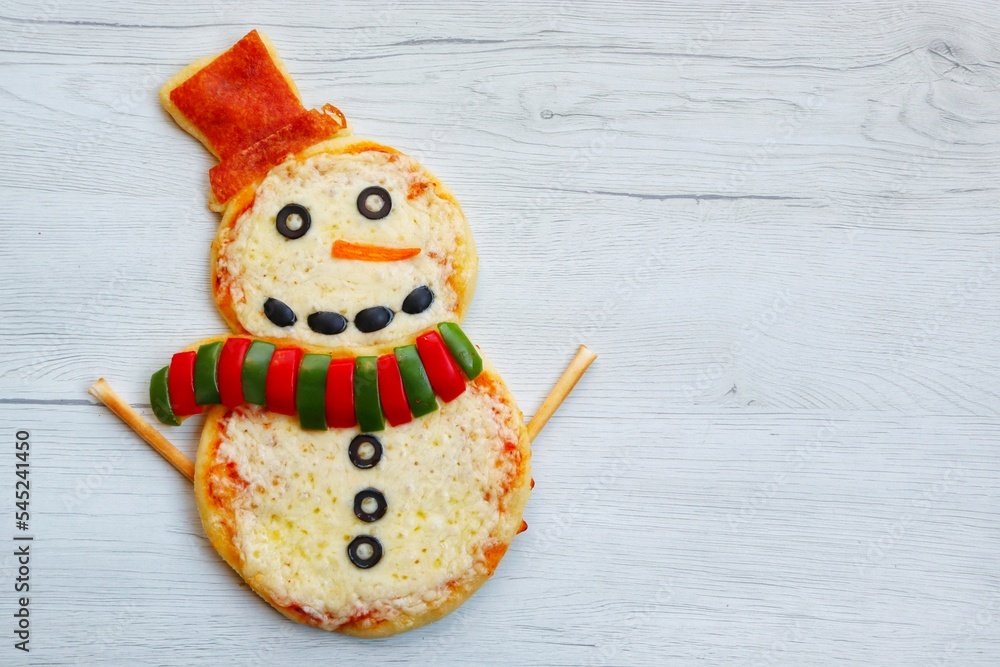 Snowman pizza made it from pizza crust,pizza sauce,mozzarella cheeses
