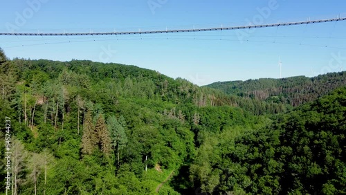 Drone view of the Geierlay Bridge surrounded by the Hunsruck Range in Western Germany photo