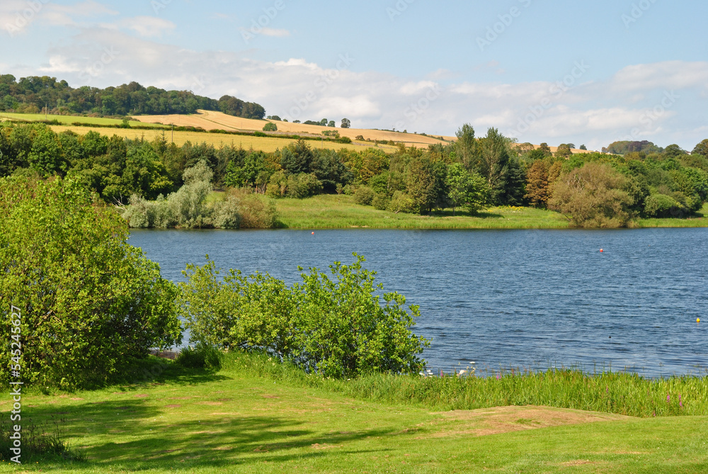 Landscape View of Lake and Hills on Sunny Day Landscape View of Lake and Hills on Sunny Day