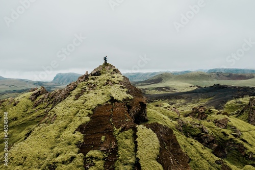 Aerial view of a man on the mountaintop of the Iceland Moss Landscape in Katla Geopark photo