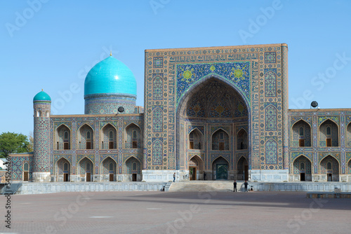 Facade of the ancient Tillya-Kori madrasah on a sunny morning. Registan Square. Samarkand, Uzbekistan