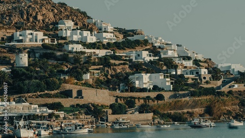 Fototapeta Naklejka Na Ścianę i Meble -  Distant shot of Mykonos Island with white buildings near the harbor, Greece