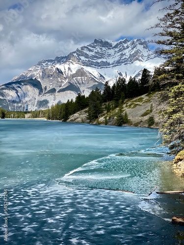 icy winter lake and mountains in Banff