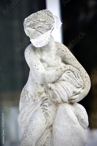 statue wearing a face mask