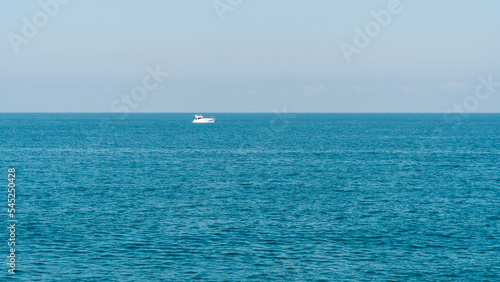 White boat on the horizon of the sea, Batumi © k_samurkas