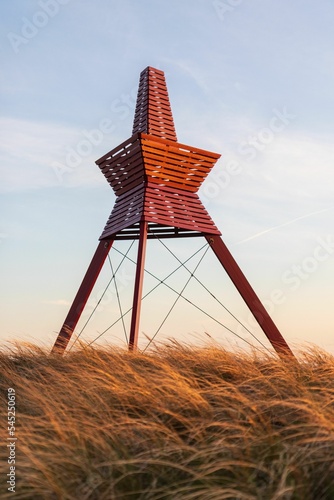 Fototapeta Red Sea Mark in Loekken, North Jutland, Denmark - vertical shot