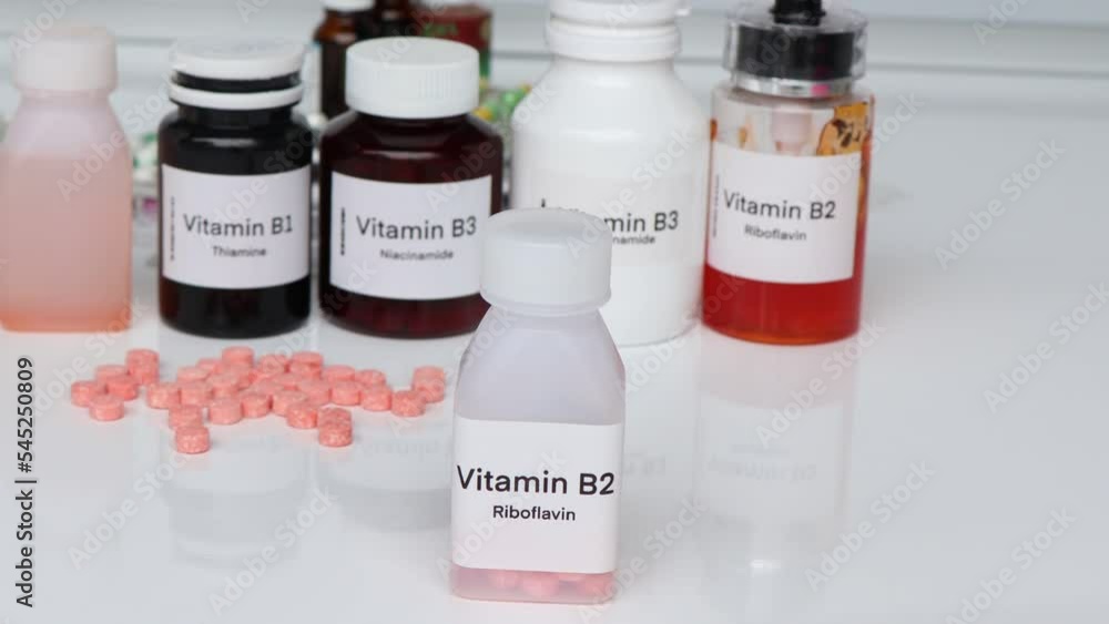 Vitamin B2 pills in a bottle, food supplement for health or used to treat disease Vitamin B2 pills in a bottle, food supplement for health or used to treat disease