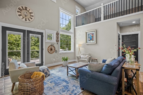 Interior design of a beautiful living room with sofas and furniture in a modern colonial home