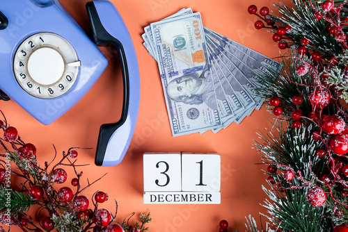 December 31 New Year, money for a gift and an old phone. christmas decor photo