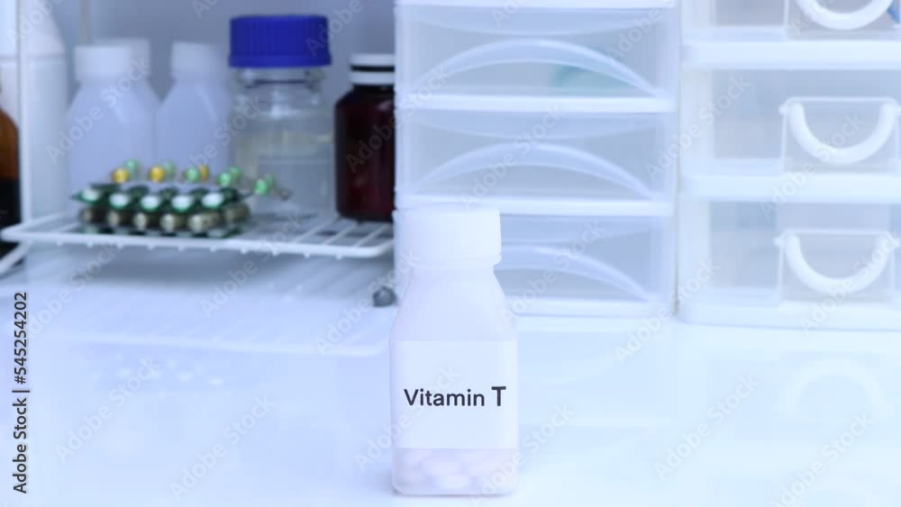 Vitamin T pills in a bottle, food supplement for health or used to treat disease Vitamin T pills in a bottle, food supplement for health or used to treat disease