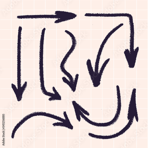 Vector arrows in different directions drawn with a brush by hand. Against the background of a checkered notebook.