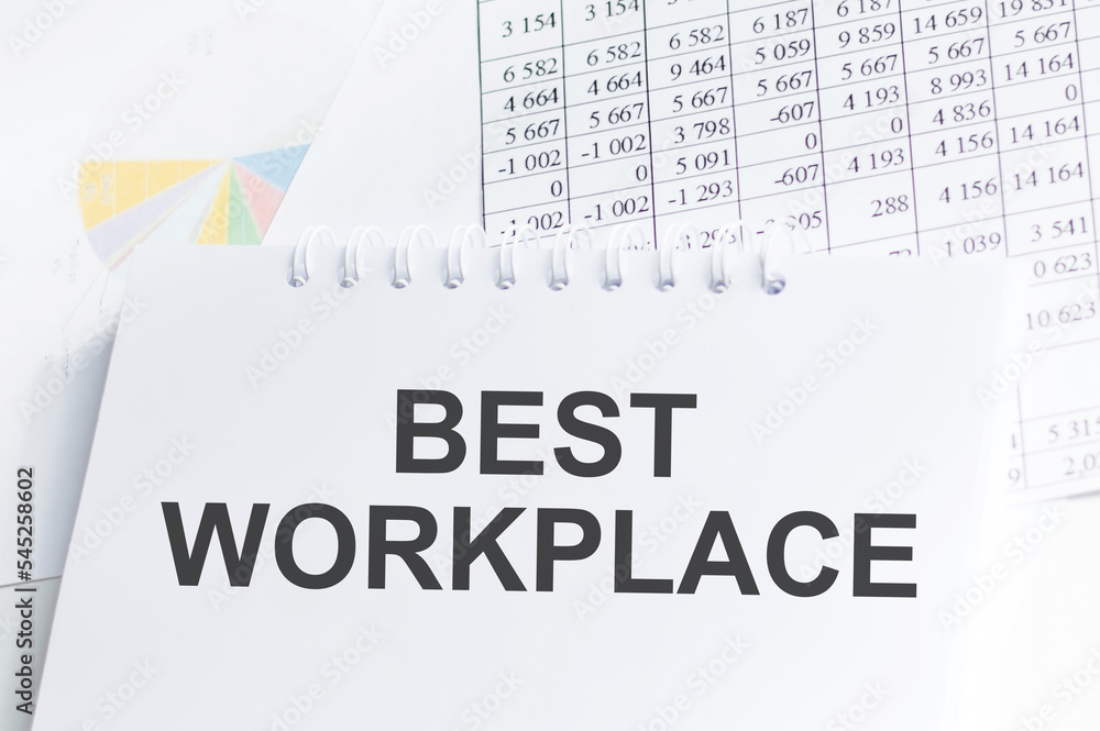 Fototapeta premium BEST WORKPLACE text concept write on a notebook on the table with documents, business concept