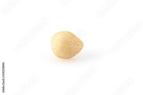 Peeled hazelnuts isolated on white background. Fried hazelnut without shell. Full depth of field. Close-up