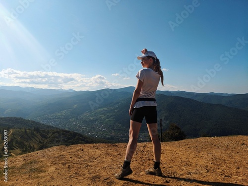 Summer and autumn hiking in the Carpathian mountains, stunning views from the tops, blue cloudy sky, fog photo