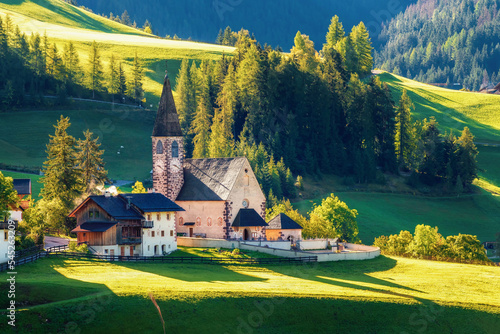Church of Santa Maddalena in beautiful morning light. A beautiful view of the mountain scenery in the Dolomites with the famous mountain village of Santa Maddalena. Val di Funes, South Tyrol,  Italy.